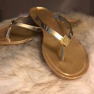 BCBG gold flip flops